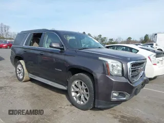 2015 GMC Yukon SLE with VIN 1GKS1AKCXFR269862, listed as a IAAI auction lot 41784763 with 156,286 mi miles. Bid and sale history available at carsss.com. Image 1.