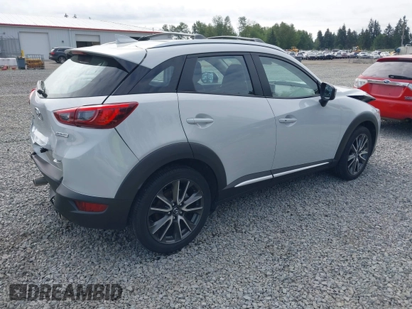 2017 Mazda CX-3 Grand Touring z VIN JM1DKFD70H0159621, wystawiony jako IAAI lot #42331482 z przebiegiem 55 166 mil mil oraz . Historia ofert i sprzedaży dostępna na DreamBid. Obrazek 4.