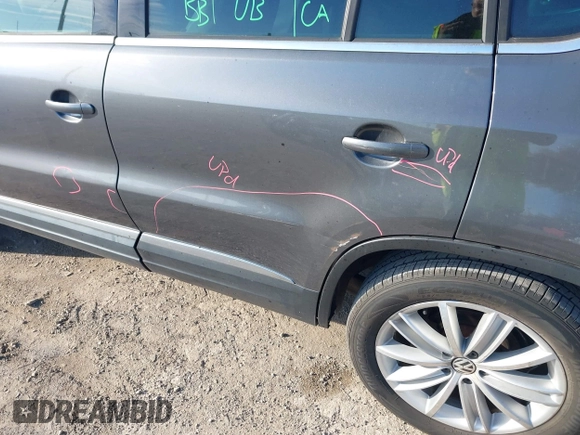 2012 Volkswagen Tiguan SEL with VIN WVGAV7AX2CW000962, listed as a IAAI auction lot 40815475 with 162,859 mi miles and . Bid and sale history available at DreamBid. Image 14.