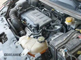 2018 Chevrolet Sonic Premier z VIN 1G1JF6SB1J4127282, wystawiony jako IAAI lot #42740961 z przebiegiem 84 338 mil mil oraz . Historia ofert i sprzedaży dostępna na DreamBid. Obrazek 19.