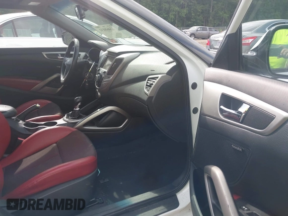 2013 Hyundai Veloster w/Gray Int z VIN KMHTC6AD3DU131703, wystawiony jako IAAI lot #42468831 z przebiegiem 188 513 mil mil oraz . Historia ofert i sprzedaży dostępna na DreamBid. Obrazek 5.