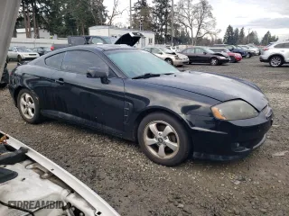 2006 Hyundai Tiburon GS with VIN KMHHM65DX6U225464, listed as a Copart auction lot 83561984 with 182,245 mi miles and Salvage Title. Bid and sale history available at carsss.com. Image 4.