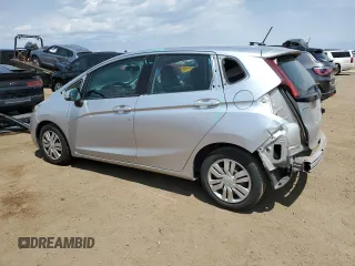2015 Honda Fit LX with VIN 3HGGK5H59FM709104, listed as a Copart auction lot 63569065 with 101,859 mi miles and Salvage title. Bid and sale history available at DreamBid. Image 2.