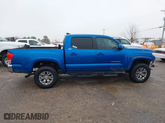 2016 Toyota Tacoma SR with VIN 5TFCZ5AN4GX013233, listed as a IAAI auction lot 41394610 with 142,099 mi miles and . Bid and sale history available at DreamBid. Image 13.