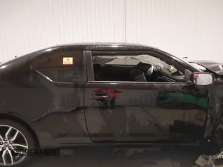 2014 Scion tC z VIN JTKJF5C74E3086243, wystawiony jako IAAI lot #40983287 z przebiegiem Nie podano mil oraz . Historia ofert i sprzedaży dostępna na DreamBid. Obrazek 14.