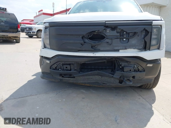 2023 Ford F-150 Lightning Pro with VIN 1FTVW1EL2PWG18764, listed as a IAAI auction lot 41908278 with 16,276 mi miles and . Bid and sale history available at DreamBid. Image 6.