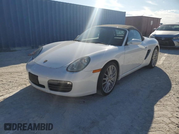 2007 Porsche Boxster S z VIN WP0CB29837U730970, wystawiony jako Copart lot #77829184 z przebiegiem Nie podano mil oraz Szkoda całkowita • Salvage title. Historia ofert i sprzedaży dostępna na DreamBid. Obrazek 1.