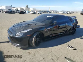 2009 Nissan GT-R Premium z VIN JN1AR54F29M250693, wystawiony jako Copart lot #88759215 z przebiegiem 47 001 mil mil oraz Szkody całkowita. Historia ofert i sprzedaży dostępna na DreamBid. Obrazek 1.