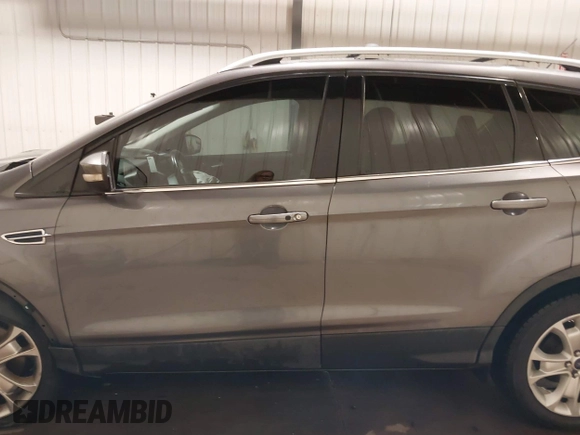 2014 Ford Escape Titanium with VIN 1FMCU9JX9EUA56421, listed as a IAAI auction lot 41392372 with 117,234 mi miles. Bid and sale history available at carsss.com. Image 15.