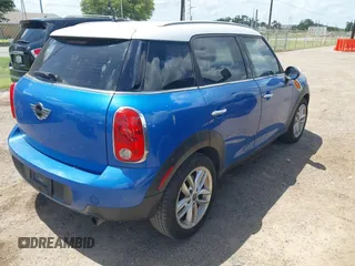 2014 MINI Countryman with VIN WMWZB3C52EWR40215, listed as a IAAI auction lot 42687571 with 106,338 mi miles and . Bid and sale history available at DreamBid. Image 4.
