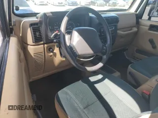 2000 Jeep Wrangler Sahara with VIN 1J4FA59S6YP790541, listed as a Copart auction lot 53837885 with 137,827 mi miles and Salvage title. Bid and sale history available at DreamBid. Image 8.
