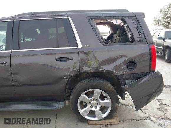 2015 Chevrolet Tahoe LT with VIN 1GNSCBKC5FR504459, listed as a IAAI auction lot 41689405 with 141,783 mi miles and . Bid and sale history available at DreamBid. Image 16.