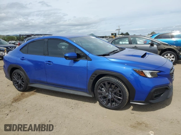 2023 Subaru WRX Premium with VIN JF1VBAF65P9824749, listed as a Copart auction lot 52210825 with 4,965 mi miles and Salvage title. Bid and sale history available at DreamBid. Image 4.