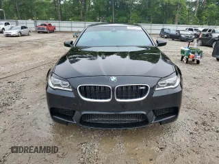 2014 BMW M5 z VIN WBSFV9C58ED097285, wystawiony jako Copart lot #55835345 z przebiegiem 108 189 mil mil oraz Szkody całkowita. Historia ofert i sprzedaży dostępna na DreamBid. Obrazek 5.