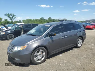 2012 Honda Odyssey Touring with VIN 5FNRL5H9XCB116701, listed as a Copart auction lot 58376435 with 275,046 mi miles and Salvage title. Bid and sale history available at DreamBid. Image 1.
