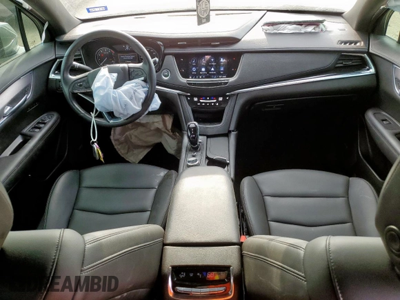 2024 Cadillac XT6 FWD Luxury with VIN 1GYKPAR41RZ700452, listed as a Copart auction lot 57675945 with 27,449 mi miles and Salvage title. Bid and sale history available at DreamBid. Image 8.