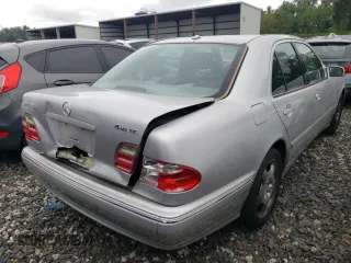 2001 Mercedes-Benz E-Class AWD with VIN WDBJF83J01X047817, listed as a Copart auction lot 71675084 with 143,127 mi miles and Salvage Title. Bid and sale history available at carsss.com. Image 3.