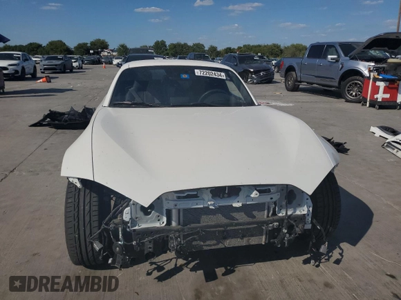 2023 Mazda MX-5 Miata Grand Touring with VIN JM1NDAM76P0561207, listed as a Copart auction lot 72202434 with 6,928 mi miles and Salvage title. Bid and sale history available at DreamBid. Image 5.
