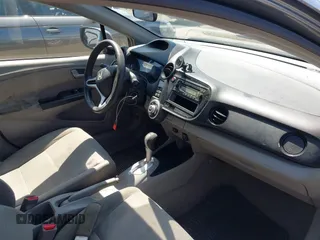 2013 Honda Insight with VIN JHMZE2H31DS002352, listed as a IAAI auction lot 42551515 with 148,393 mi miles and . Bid and sale history available at DreamBid. Image 5.