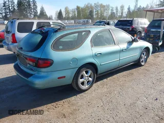 2000 Ford Taurus SE Standard z VIN 1FAFP582XYG181481, wystawiony jako IAAI lot #42033520 z przebiegiem 151 073 mil mil oraz . Historia ofert i sprzedaży dostępna na DreamBid. Obrazek 4.