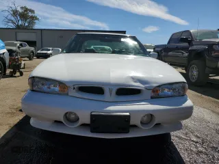 1999 Pontiac Bonneville SE z VIN 1G2HX52K3XH226172, wystawiony jako Copart lot #71655164 z przebiegiem 242 429 mil mil oraz Szkoda całkowita • Salvage title. Historia ofert i sprzedaży dostępna na DreamBid. Obrazek 5.
