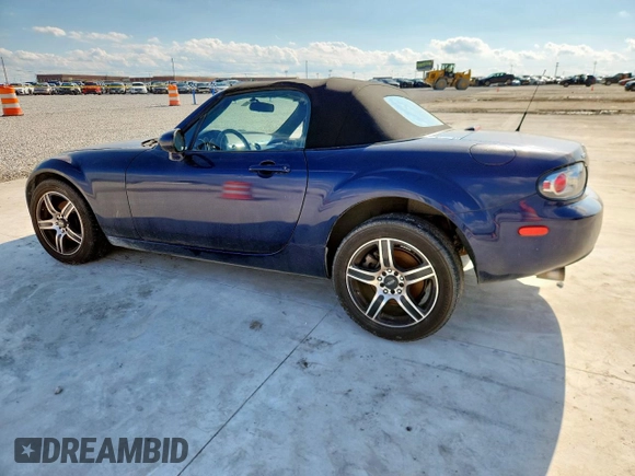2007 Mazda MX-5 Miata Touring with VIN JM1NC25F770138120, listed as a Copart auction lot 60777425 with 184,029 mi miles and Salvage title. Bid and sale history available at DreamBid. Image 2.