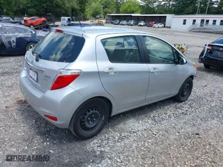 2012 Toyota Yaris L with VIN JTDKTUD33CD527720, listed as a IAAI auction lot 39764258 with 118,041 mi miles. Bid and sale history available at carsss.com. Image 4.