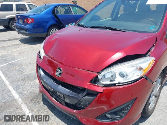 2015 Mazda 5 Grand Touring with VIN JM1CW2DL6F0190312, listed as a IAAI auction lot 42433782 with 79,140 mi miles and . Bid and sale history available at DreamBid. Image 6.