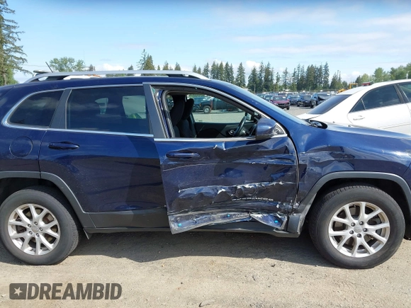2015 Jeep Cherokee Latitude with VIN 1C4PJMCB0FW702535, listed as a IAAI auction lot 42149898 with 125,938 mi miles and . Bid and sale history available at carsss.com. Image 13.