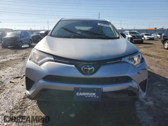 2018 Toyota RAV4 LE with VIN 2T3BFREV2JW730084, listed as a Copart auction lot 50386335 with 56,650 mi miles and Salvage Title. Bid and sale history available at carsss.com. Image 5.