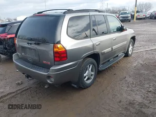 2005 GMC Envoy SLT with VIN 1GKDT13S752276414, listed as a IAAI auction lot 41052684 with 200,919 mi miles. Bid and sale history available at carsss.com. Image 4.