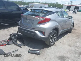 2018 Toyota C-HR XLE with VIN JTNKHMBX7J1009692, listed as a IAAI auction lot 42390685 with 77,866 mi miles and . Bid and sale history available at DreamBid. Image 4.