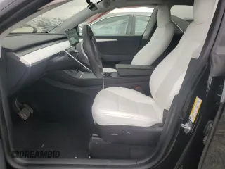 2023 Tesla Model Y Long Range with VIN 7SAYGAEE0PF642810, listed as a Copart auction lot 52181655 with 74,922 mi miles and Salvage Title. Bid and sale history available at DreamBid. Image 7.