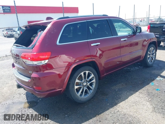 2017 Jeep Grand Cherokee Overland with VIN 1C4RJFCG7HC658943, listed as a IAAI auction lot 42282213 with 103,291 mi miles and . Bid and sale history available at DreamBid. Image 4.