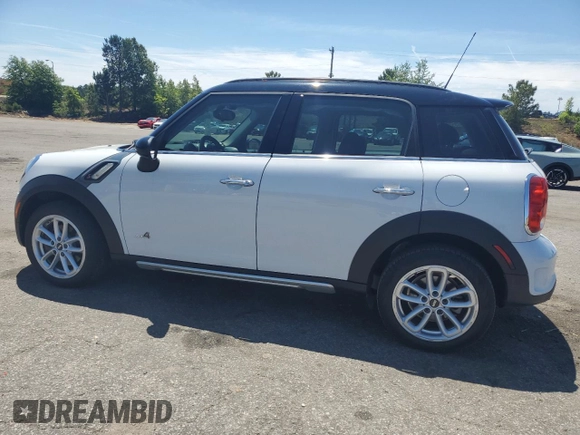 2016 MINI Countryman S with VIN WMWZC5C51GWU00690, listed as a Copart auction lot 55077095 with 104,176 mi miles and Salvage title. Bid and sale history available at DreamBid. Image 2.