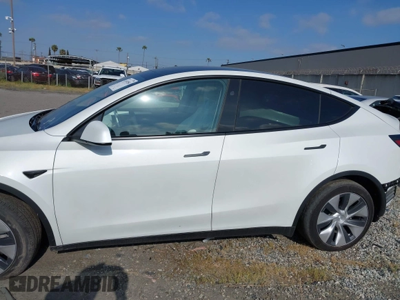 2024 Tesla Model Y with VIN 7SAYGDED2RF017448, listed as a IAAI auction lot 41597056 with 9,702 mi miles and . Bid and sale history available at DreamBid. Image 14.