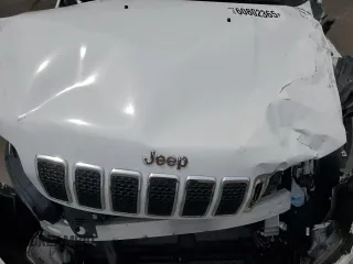2019 Jeep Cherokee Latitude Plus z VIN 1C4PJMLN0KD372668, wystawiony jako Copart lot #60802365 z przebiegiem Nie podano mil oraz Szkoda całkowita • Salvage title. Historia ofert i sprzedaży dostępna na DreamBid. Obrazek 12.