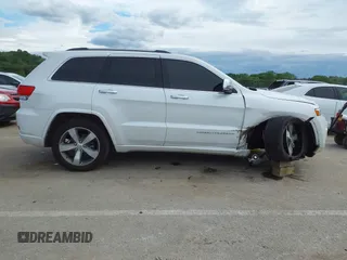 2016 Jeep Grand Cherokee Overland with VIN 1C4RJFCG2GC490420, listed as a IAAI auction lot 42200700 with 97,007 mi miles and . Bid and sale history available at DreamBid. Image 13.