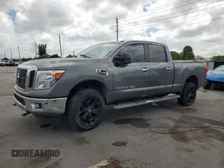 2016 Nissan Titan SL z VIN 1N6BA1F48GN512511, wystawiony jako Copart lot #54707805 z przebiegiem 152 406 mil mil oraz Czysty tytuł • Clean title. Historia ofert i sprzedaży dostępna na DreamBid. Obrazek 1.