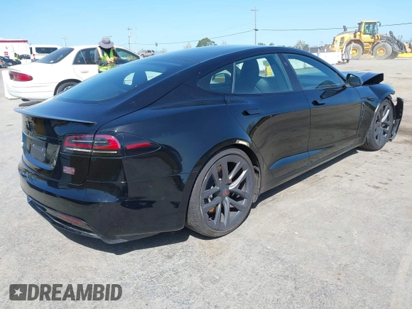 2022 Tesla Model S Plaid with VIN 5YJSA1E61NF483354, listed as a IAAI auction lot 41973636 with 32,541 mi miles and . Bid and sale history available at DreamBid. Image 4.