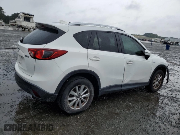 2016 Mazda CX-5 Touring z VIN JM3KE2CY5G0849288, wystawiony jako Copart lot #54594545 z przebiegiem 90 882 mil mil oraz Szkoda całkowita • Salvage title. Historia ofert i sprzedaży dostępna na DreamBid. Obrazek 3.