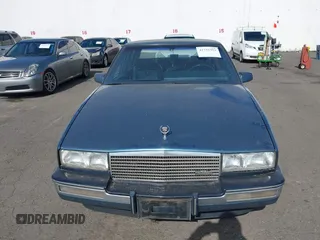 1986 Cadillac Seville z VIN 1G6KS6989GU813079, wystawiony jako IAAI lot #41732353 z przebiegiem Nie podano mil oraz . Historia ofert i sprzedaży dostępna na DreamBid. Obrazek 6.