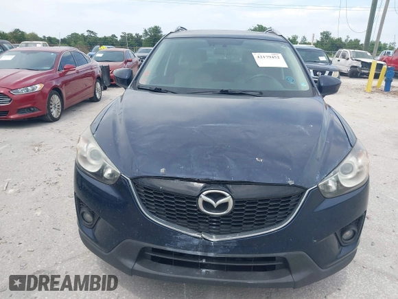 2014 Mazda CX-5 Grand Touring with VIN JM3KE2DY8E0425258, listed as a IAAI auction lot 42179452 with 132,137 mi miles. Bid and sale history available at carsss.com. Image 6.