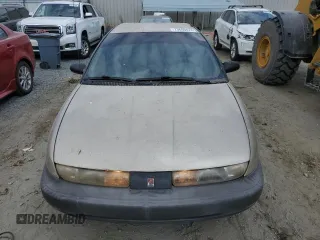 1999 Saturn SL z VIN 1G8ZH5280XZ178863, wystawiony jako Copart lot #73660474 z przebiegiem 195 738 mil mil oraz Szkody całkowita. Historia ofert i sprzedaży dostępna na DreamBid. Obrazek 5.