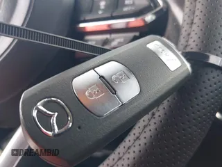 2018 Mazda CX-5 Touring z VIN JM3KFACM6J1419663, wystawiony jako IAAI lot #41879677 z przebiegiem 115 224 mil mil oraz . Historia ofert i sprzedaży dostępna na DreamBid. Obrazek 11.
