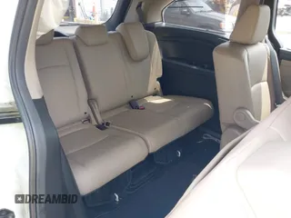 2021 Honda Odyssey Touring with VIN 5FNRL6H80MB010952, listed as a IAAI auction lot 42080412 with 90,594 mi miles and . Bid and sale history available at DreamBid. Image 8.