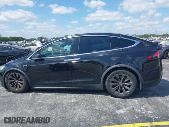 2017 Tesla Model X 90D with VIN 5YJXCBE21HF054898, listed as a IAAI auction lot 42076462 with 89,996 mi miles and . Bid and sale history available at DreamBid. Image 13.