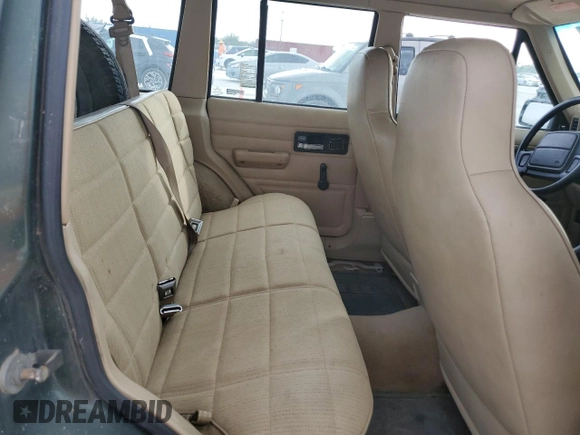 1996 Jeep Cherokee SE z VIN 1J4FJ28S9TL211073, wystawiony jako Copart lot #78052574 z przebiegiem 174 967 mil mil oraz Nie do naprawy • Non repairable. Historia ofert i sprzedaży dostępna na DreamBid. Obrazek 11.