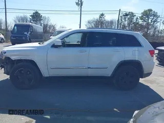 2012 Jeep Grand Cherokee Laredo with VIN 1C4RJFAT4CC229204, listed as a IAAI auction lot 41659491 with 141,143 mi miles. Bid and sale history available at carsss.com. Image 14.