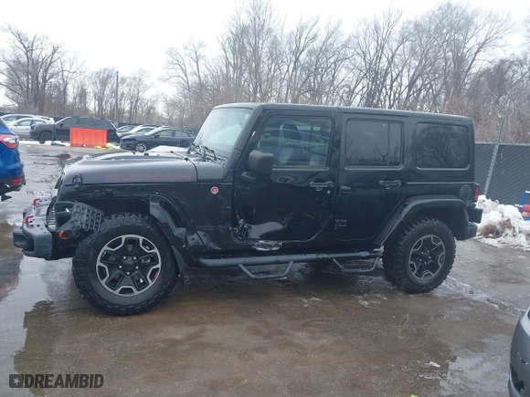2015 Jeep Wrangler Unlimited Rubicon Hard Rock with VIN 1C4HJWFG9FL569962, listed as a IAAI auction lot 41557801 with 78,597 mi miles. Bid and sale history available at carsss.com. Image 14.